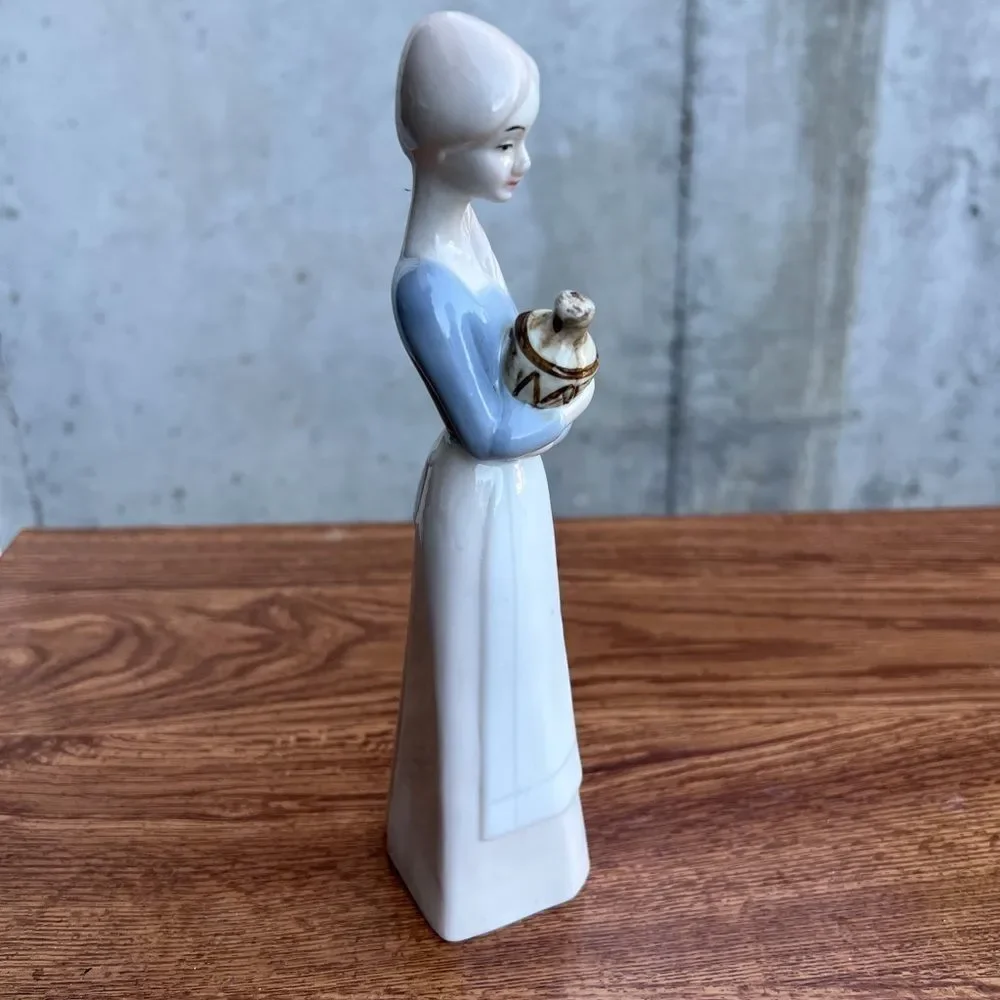 Porcelain Pheasant Lady Holding A Jug Good Condition
